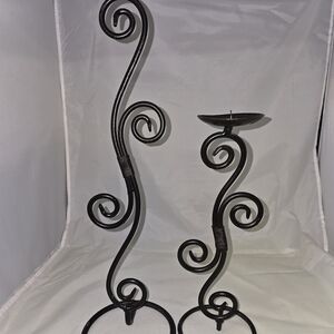 set of two black wrought iron pillar candle holders with a double-curl Design